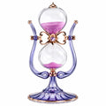 Elegante Sanduhr mit violettem Sand und Glasrahmen